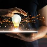 Pushing a Stagnating Company to Innovation Abstract. Innovation. Hands holding tablet with light bulb futur